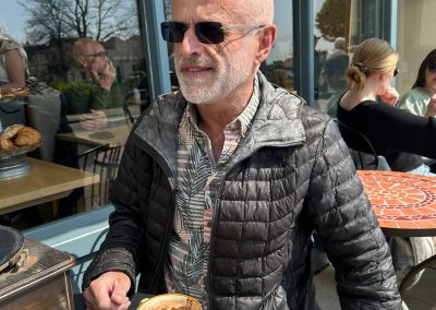 Man sat outside coffee shop