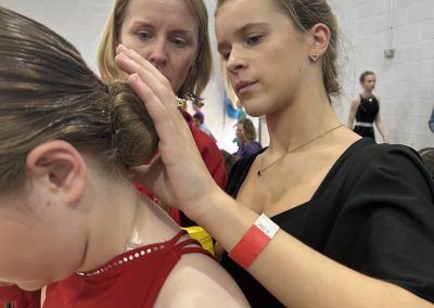 Teacher preparing dance students